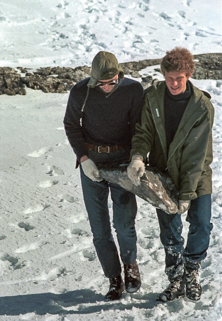 Lars Boje and Niels Holmsgaard collecting building  material for the cairn .